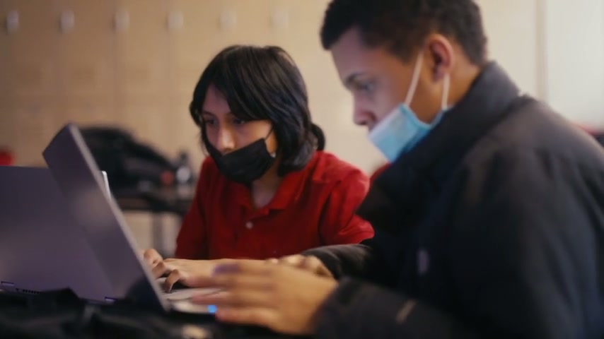 Clinton students working together on laptops in the school’s Computer Science film